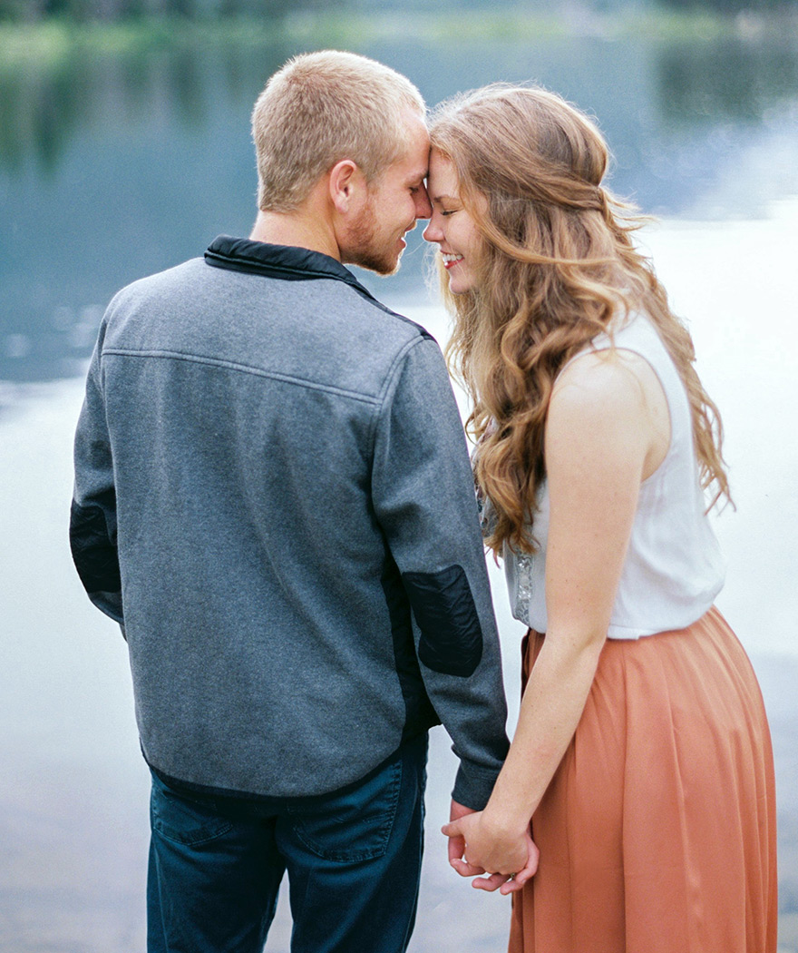 Couple holding hands sharing sweet moment in Colorado Rockies