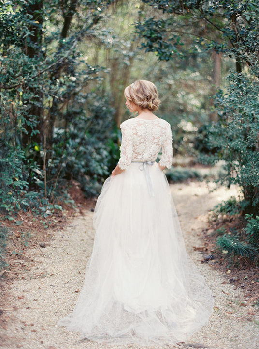 Gorgeous modern lace back wedding dress with tulle skirt and ribbon tie. Bridal updo hair ideas. 