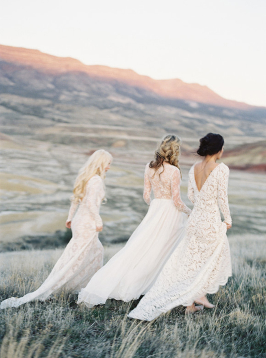 Three gorgeous full length white wedding gowns all with lace details. 