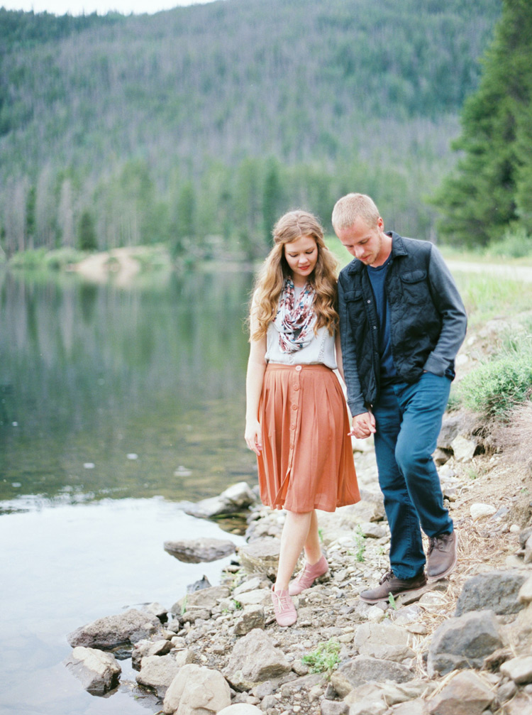 Couple holding hands side by side near Lakeside, Colorado