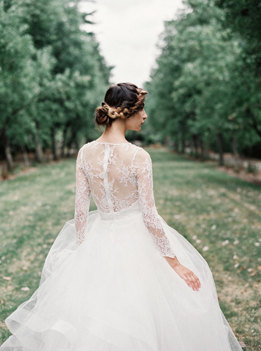 Gorgeous long sleeve lace back wedding dress with tulle layered skirt. 