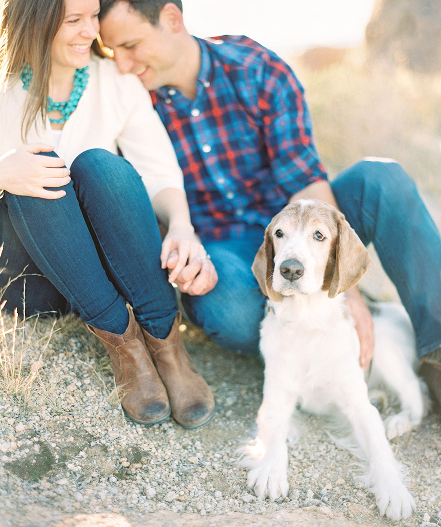 Laughing together and holding hands -- comfortable outdoor engagement shoot. Dogs are family!