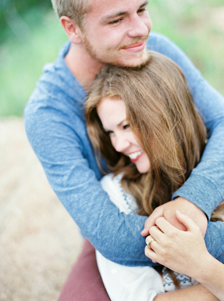 Personal embrace of engaged couple outdoor session in Colorado
