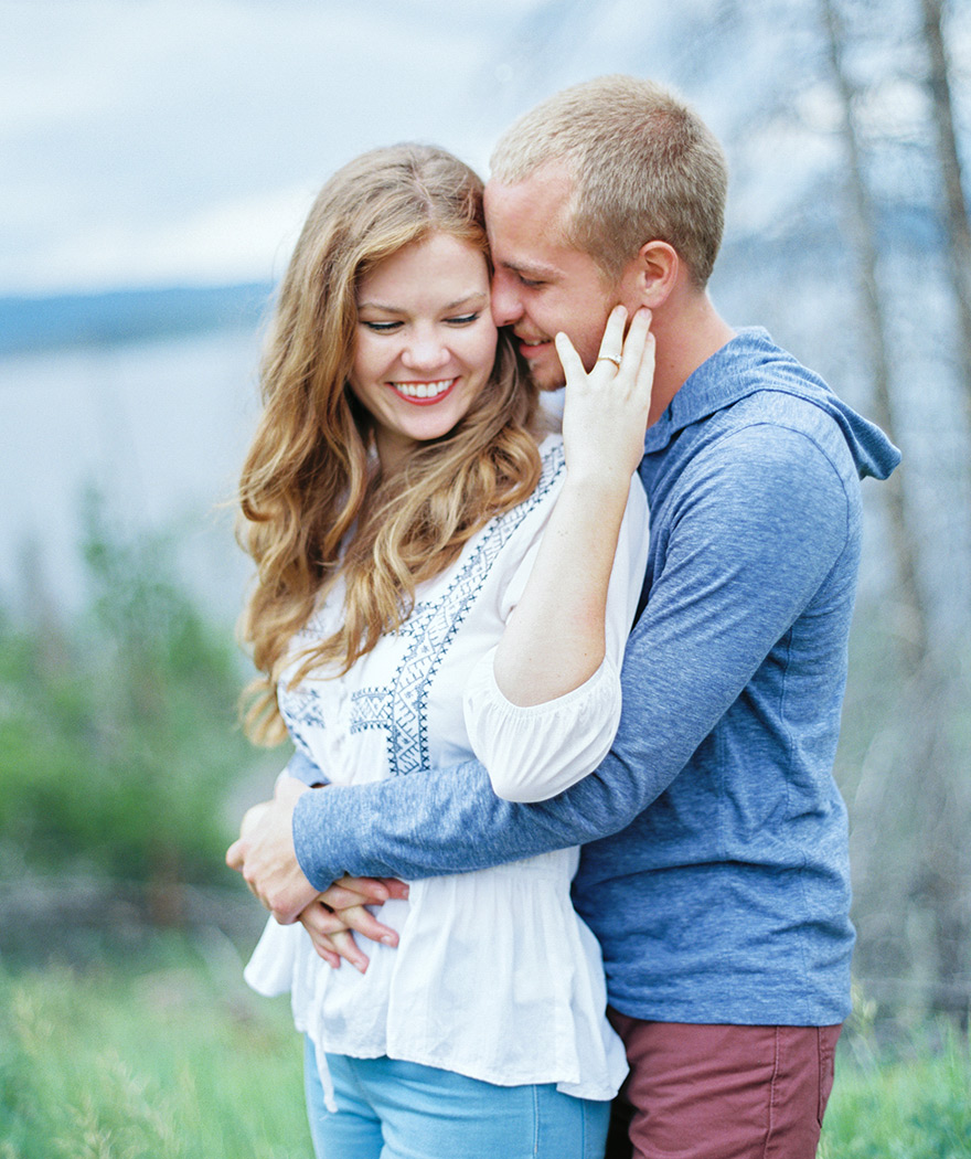 Bride & Groom embrace each other closely in Colorado outdoor fields