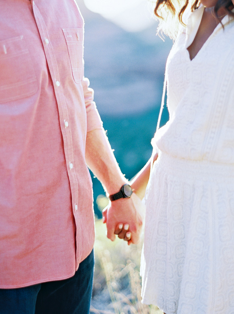 Holding hands as the sun sets in Sedona. Outdoor engagement photos. 