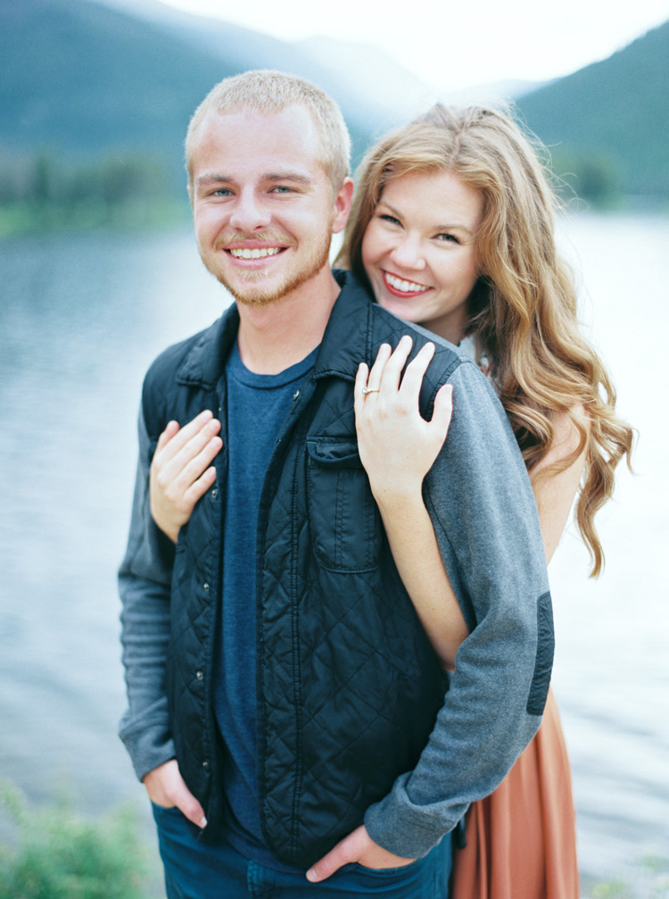 Bride embraces her groom in outdoor shoot in Lakeside, Colorado