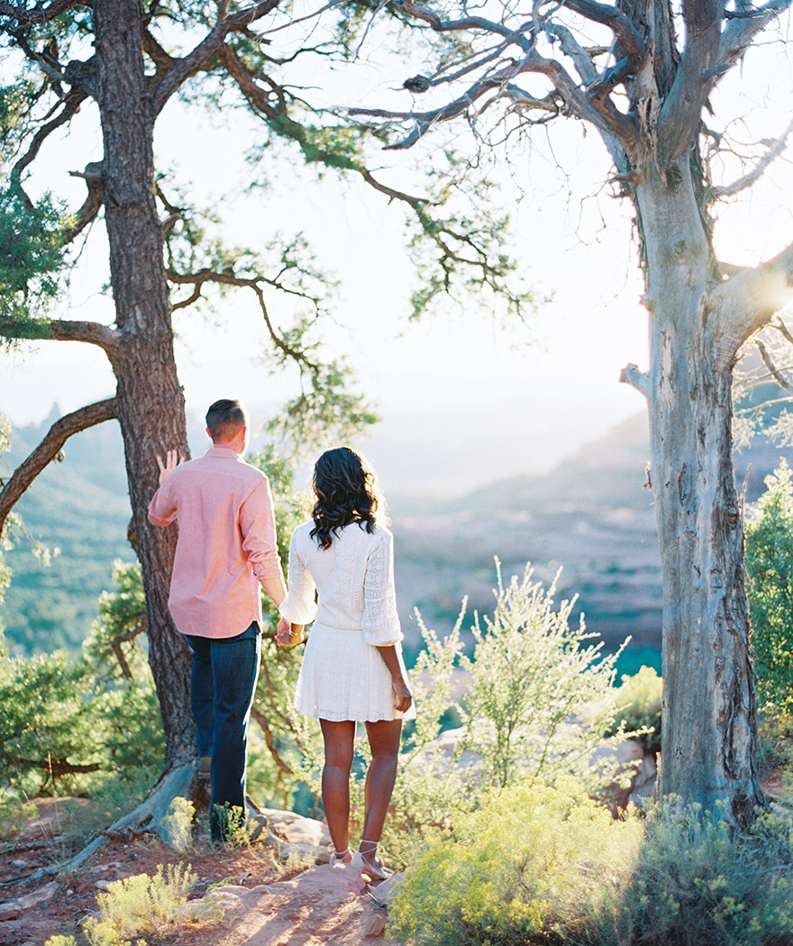 Hand in hand, gazing out at the red rocks of Sedona. Stunning engagement shoot!