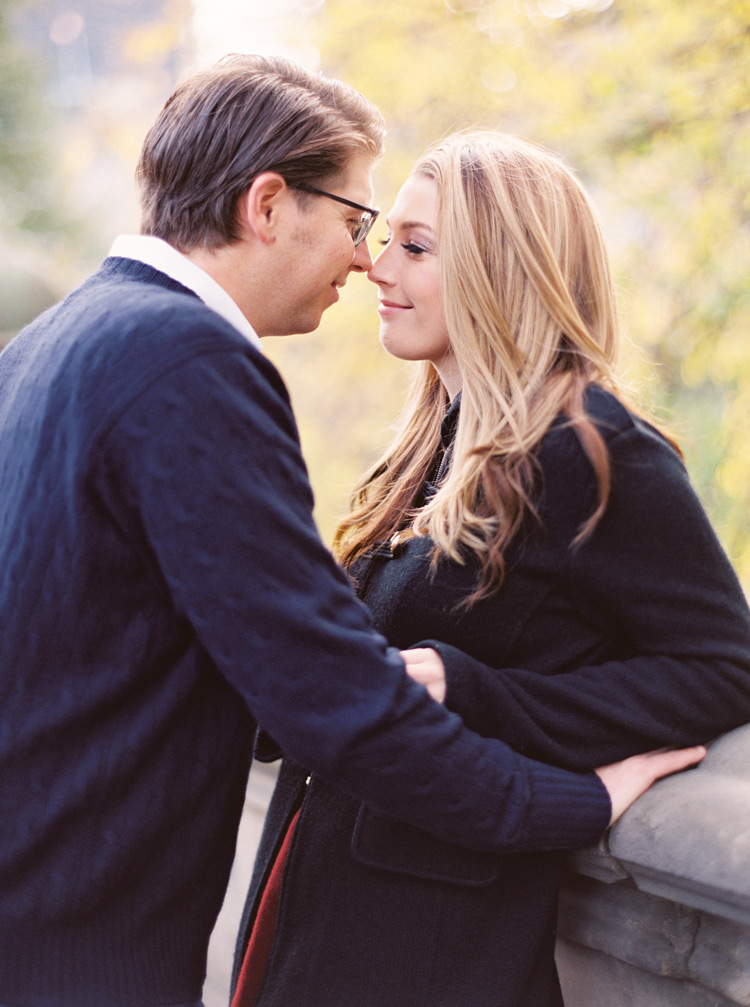 Sweet nuzzle of a couple in love. Autumn in New York, Central Park engagement shoot.