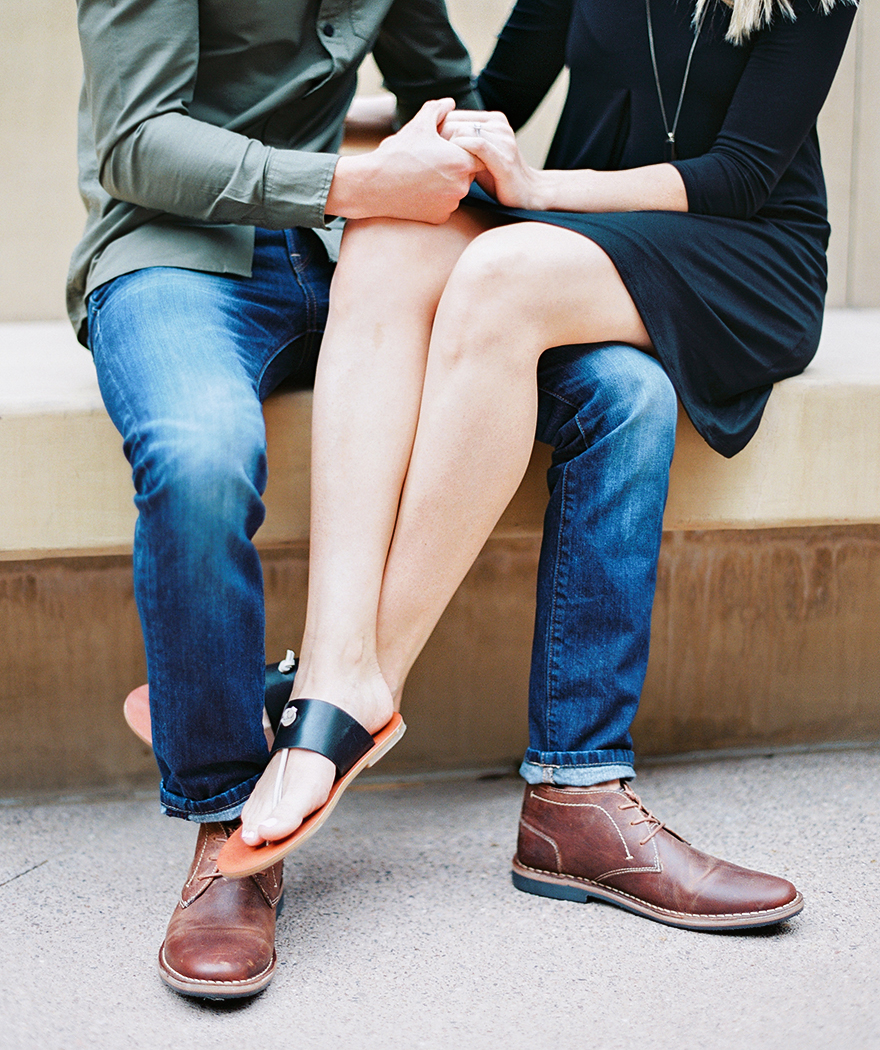 brown shoes for him; sandals for her