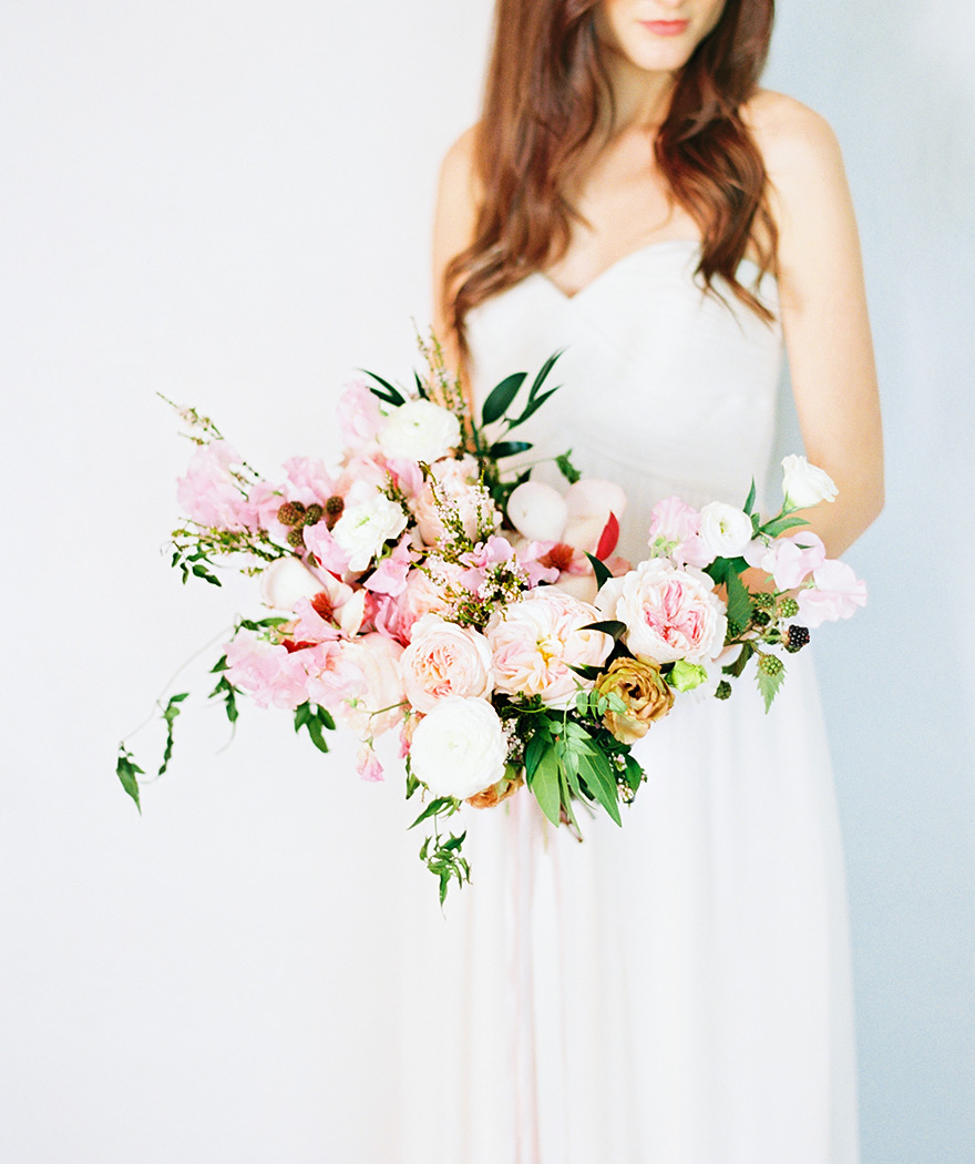 Lush, organic bouquet design full of peonies, garden roses, and blackberries. Wedding flowers