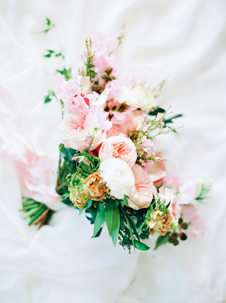 Lush, organic bouquet design full of peonies, roses, and blackberries. Wedding flowers