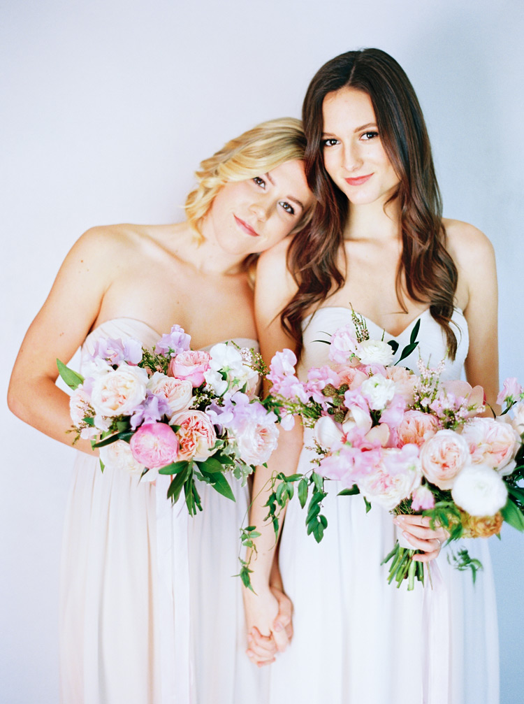 Pale, strapless gowns & soft bouquets of peonies, roses, sweet pea. Wedding flowers & best friends