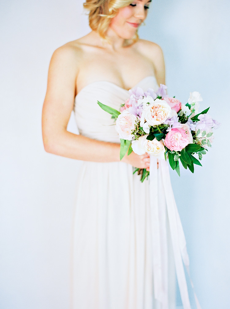 Pale, strapless gown & soft bouquet of peonies, sweet pea and greenery. Wedding flowers