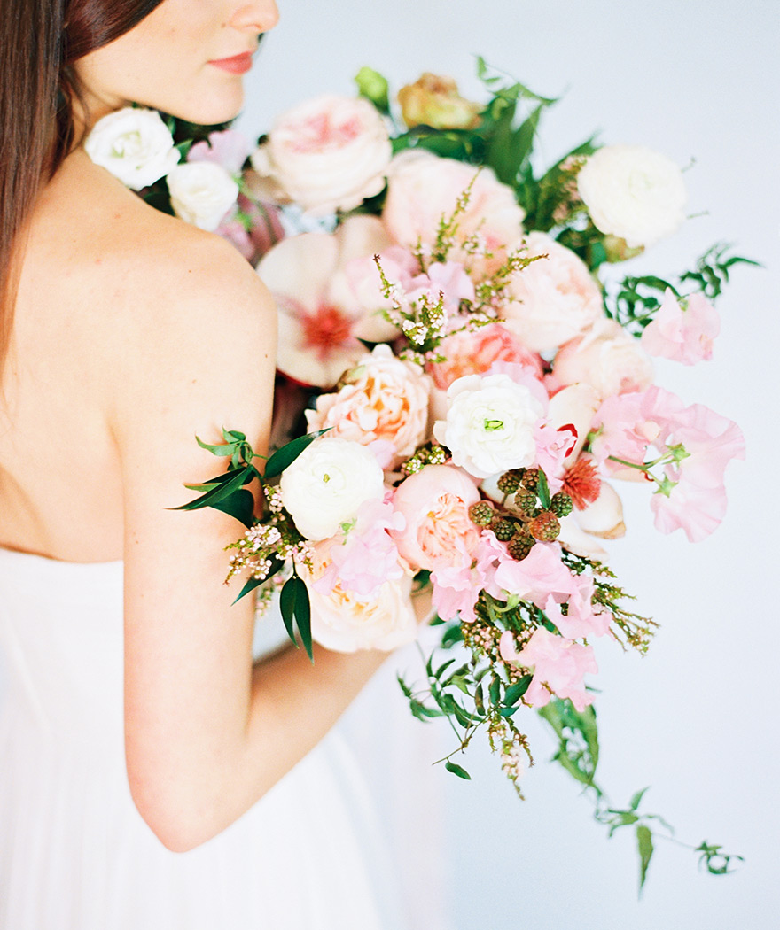 Soft, full bouquet of peonies, ranunculus, blackberry. Loose, modern wedding flowers.