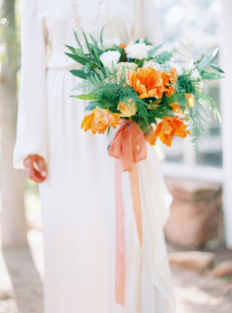 Vibrant orange and white wedding bouquet 