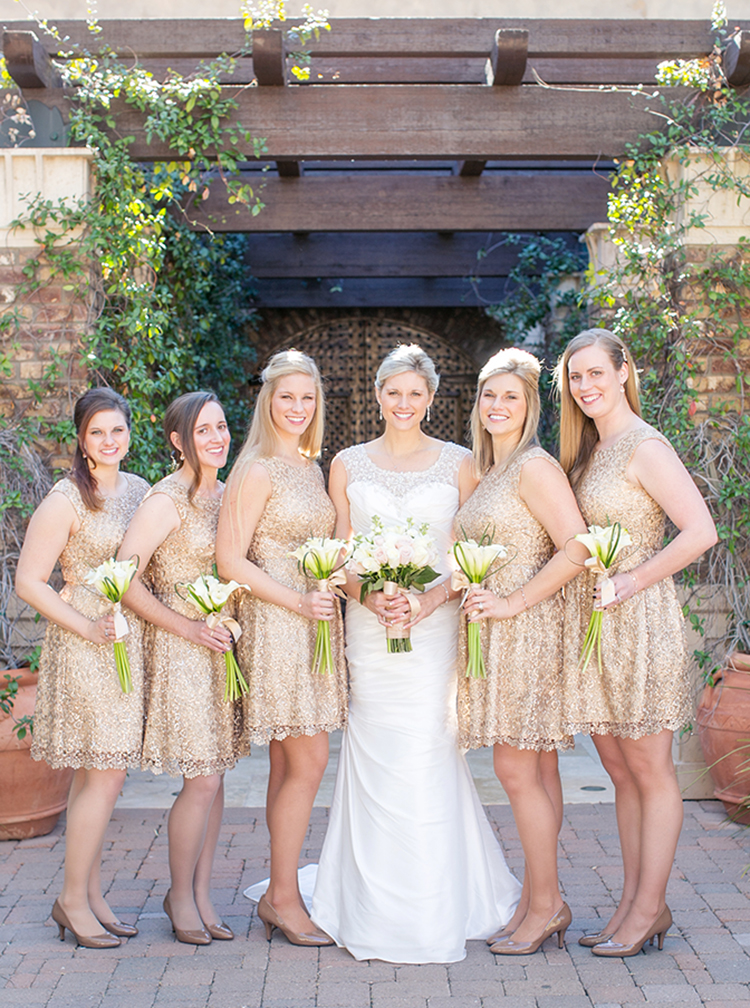 Glitter and gold bridesmaids posing with simple bouquet and bride shoot 