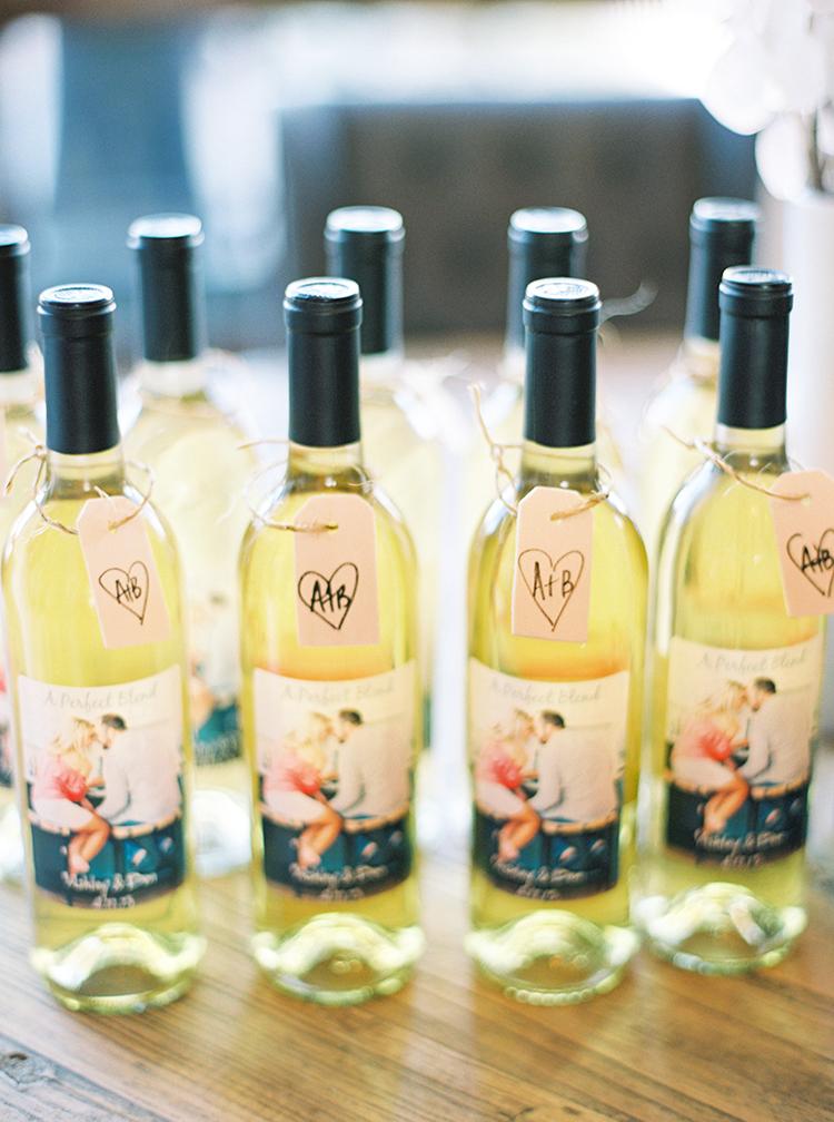 Wine bottles decorated with photo labels and hand written tags. DIY wedding ideas. 