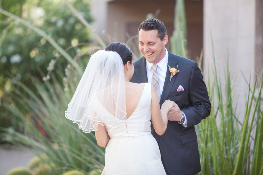 Groom laughs with joy as he see his bride before the wedding.