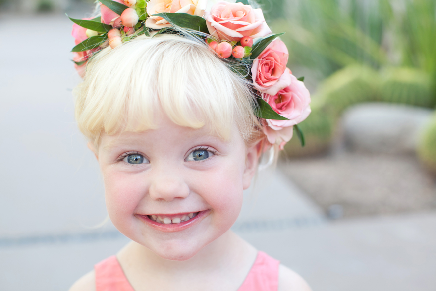 Flower girl is pretty in pink with a flower crown.