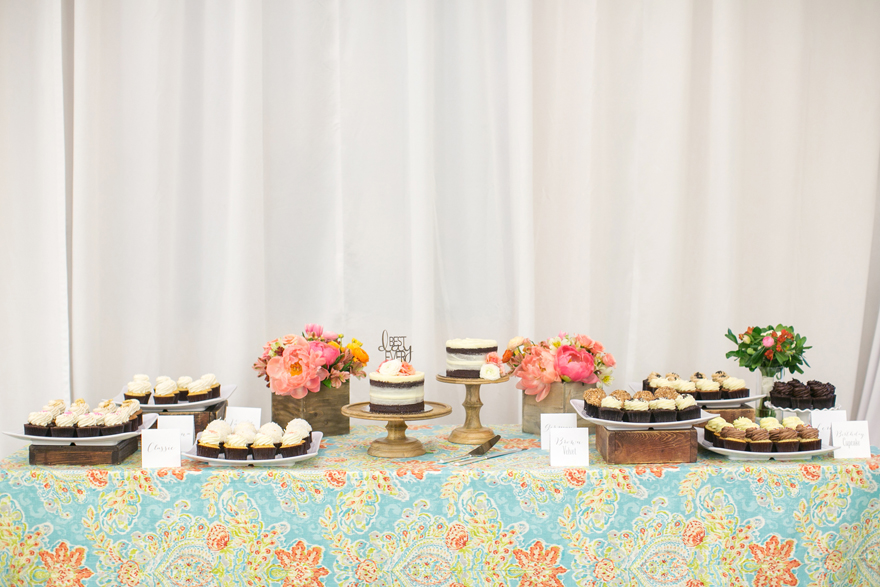 Desert table full of treats at the wedding reception. Creative linens.
