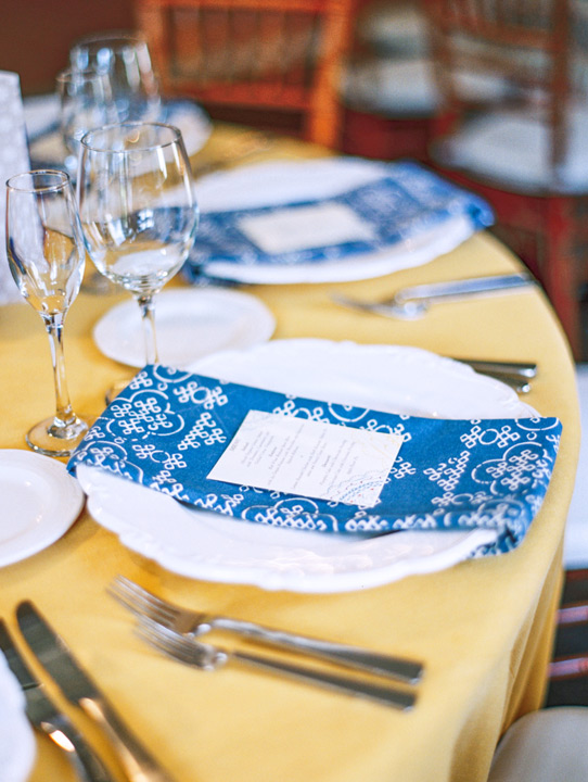 Blue and yellow table settings for wedding reception. Table decor and plate settings ideas. 