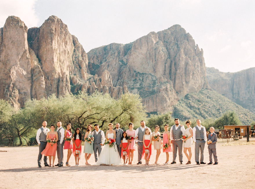 Coral bridal party at Saguaro Lake Ranch in Mesa, Arizona. Beautiful mountain backdrop for wedding. 