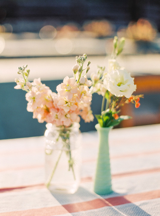 Delicate and simple wedding floral table arrangements for destination wedding. 