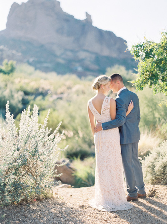 Bride and groom stand in nature at their destination wedding at the Sanctuary on Camelback. 