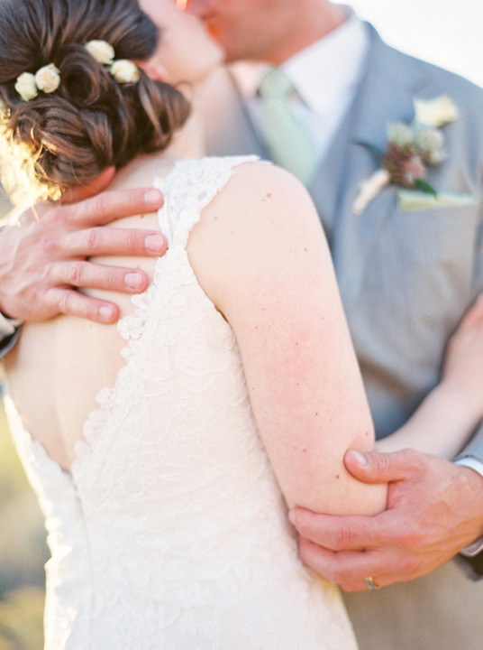 Lace detail wedding dress and bridal updo. 
