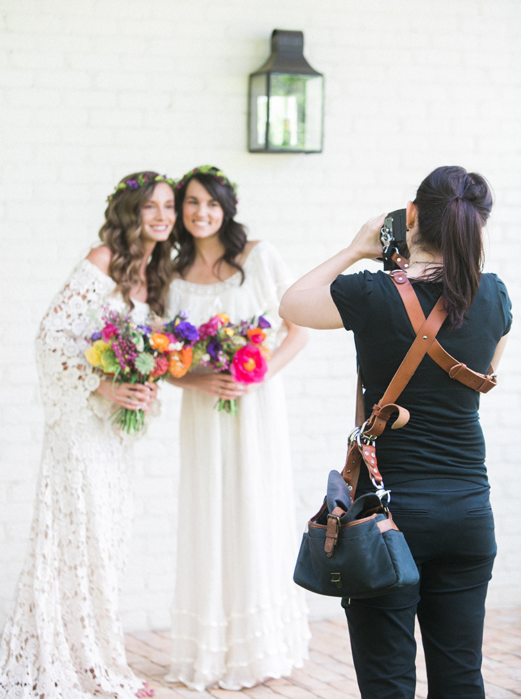 Wedding photographer shooting a boho bride & bridesmaid