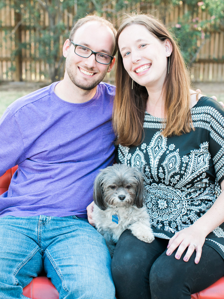 Happy couple with puppy. Outdoor fun.