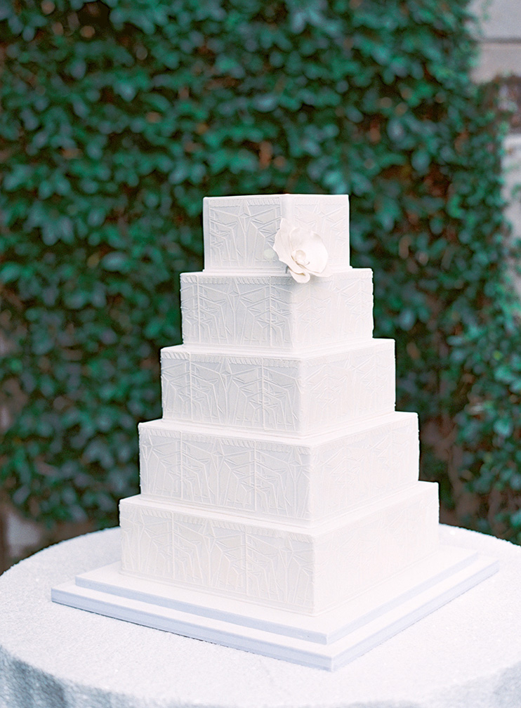 all white wedding cake inspired by Frank Lloyd Wright's Biltmore blocks