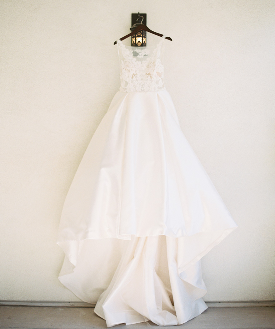 wedding dress of satin, illusion, and lace by Lazaro