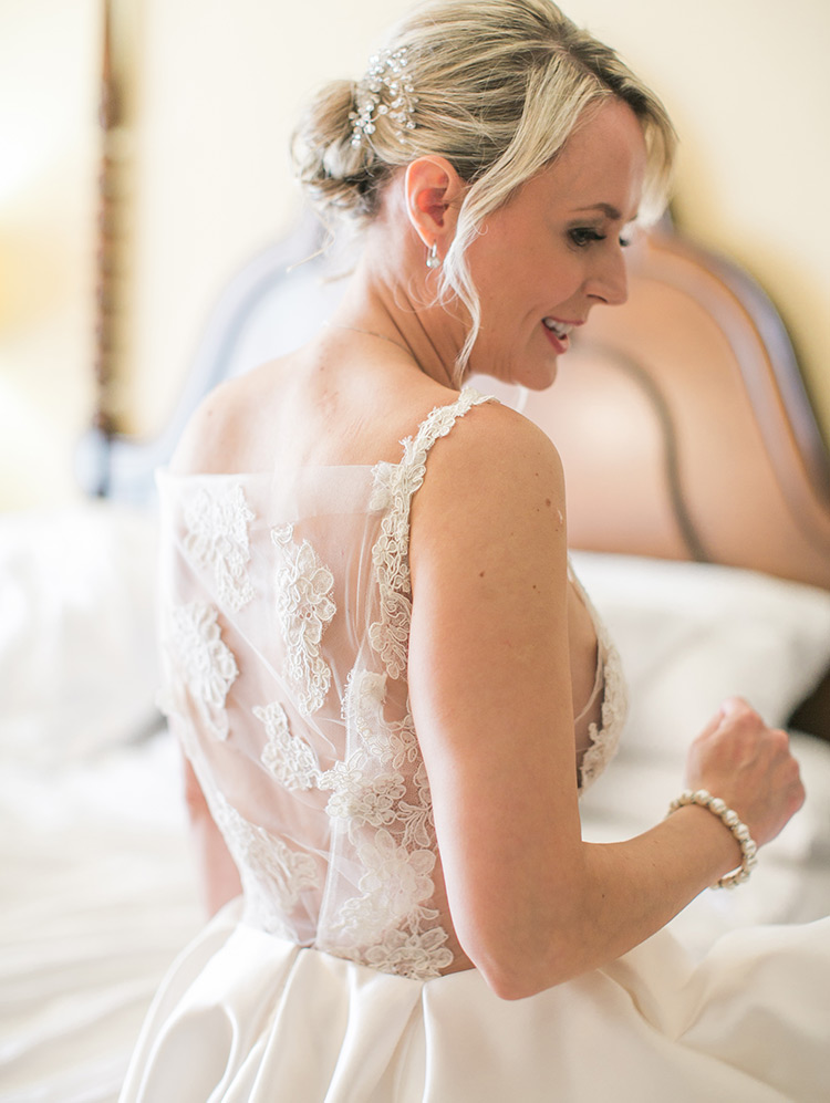 wedding dress of satin, illusion, and lace