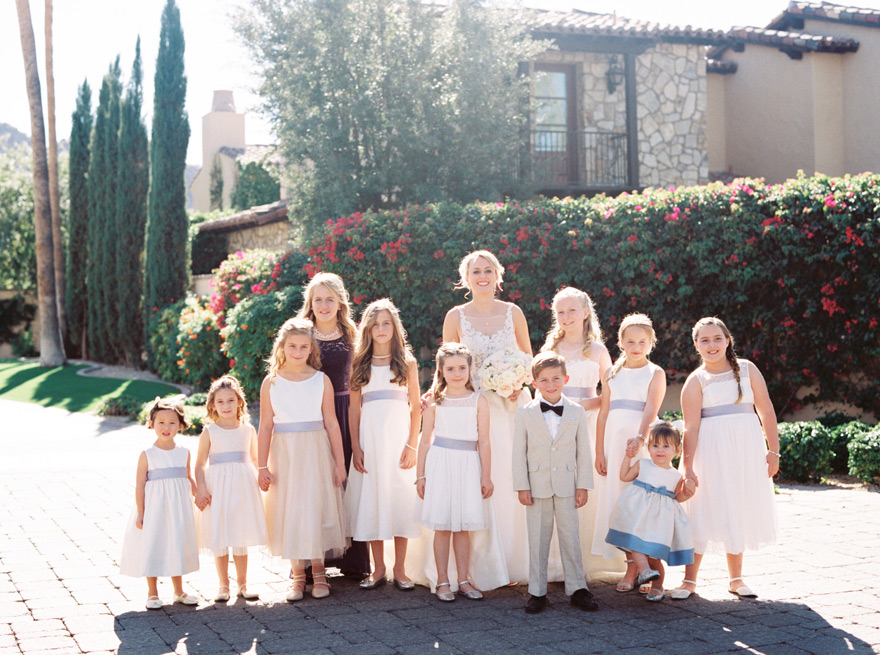 bride with her 10 flower girls