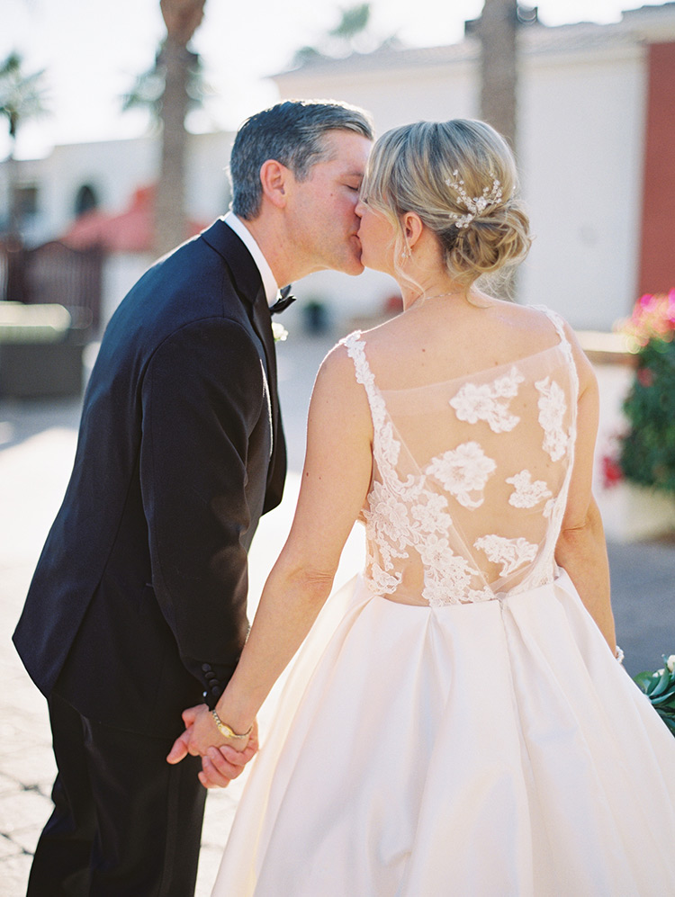 wedding dress of satin, illusion, and lace