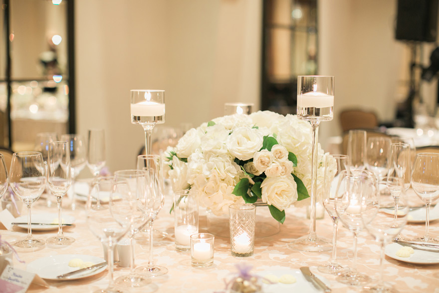ballroom reception with candlelight and white flowers