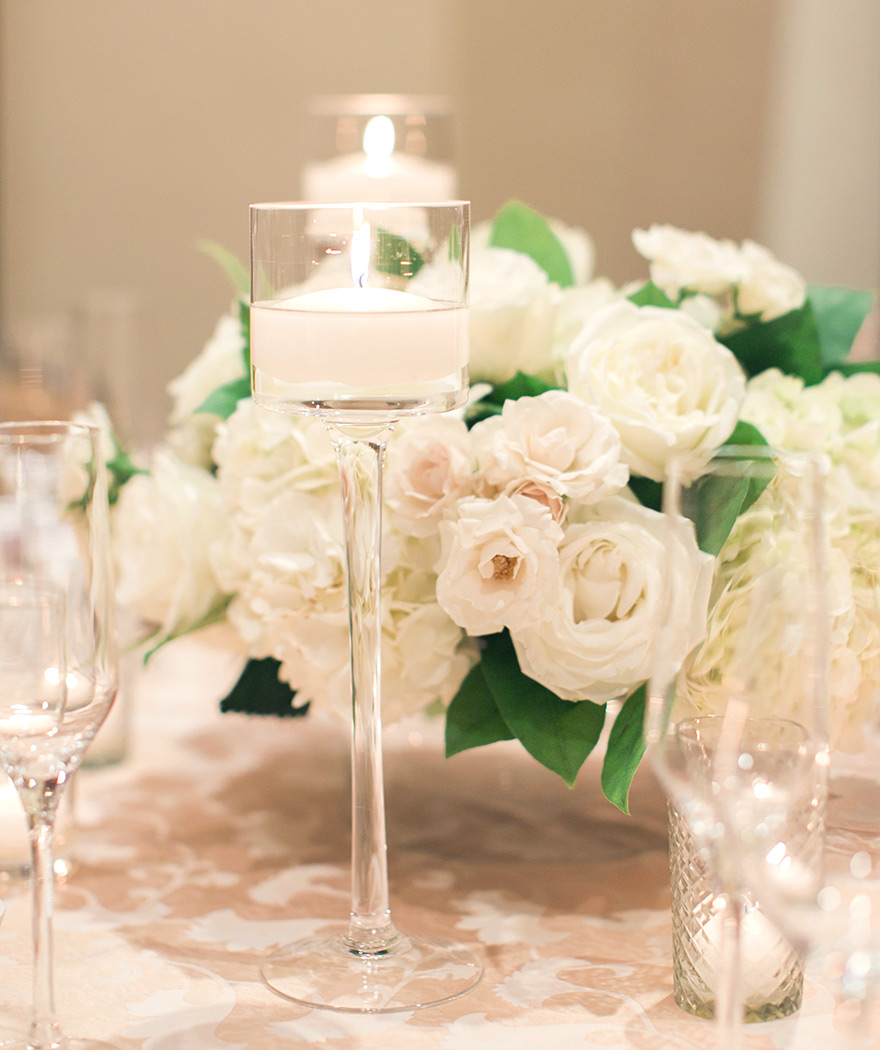 wedding reception centerpiece of delicate white flowers 