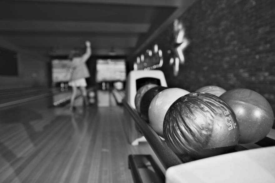 black and white photo of a bowling alley