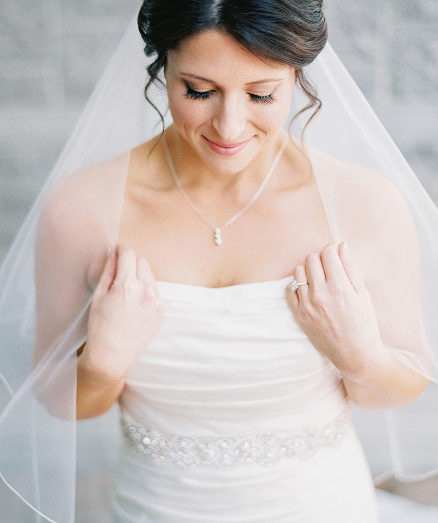 strapless wedding dress and fingertip-length veil