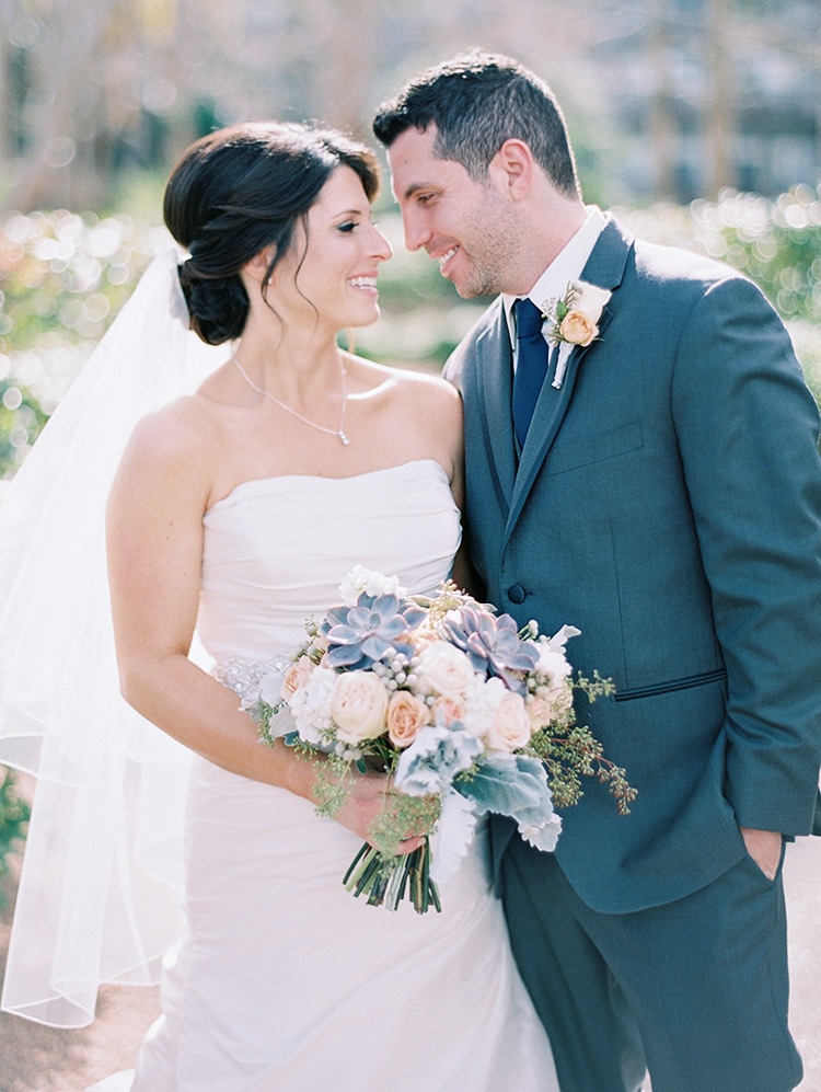 elegant bride & groom, pale peach bouquet with succulents & dusty miller