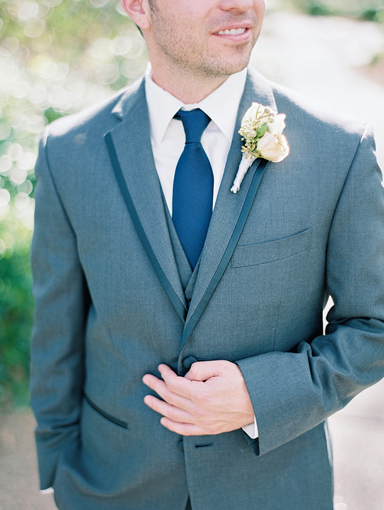 groom in a grey three-piece suit