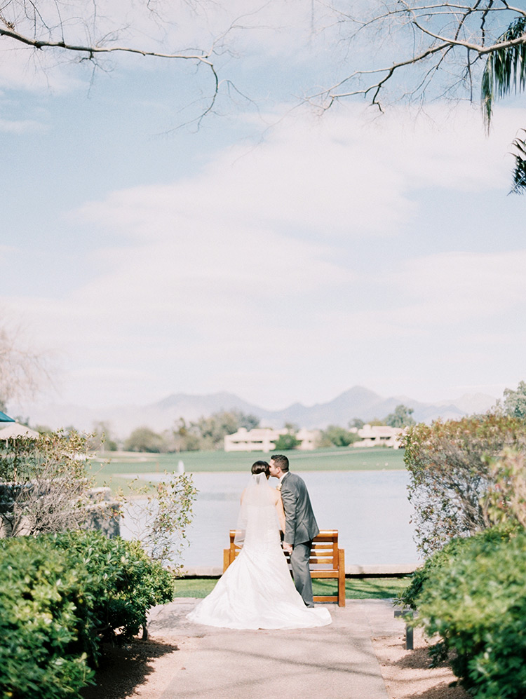 bride & groom kiss by the water, Phoenix wedding