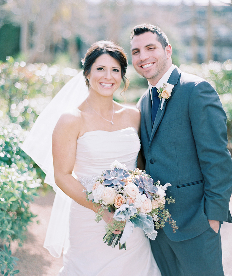 elegant bride & groom, pale peach bouquet with succulents & dusty miller