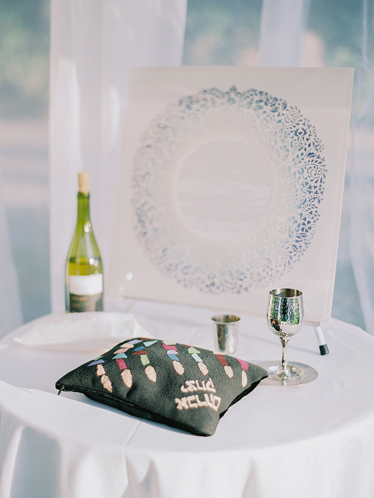 ketubah and kiddish cup wait for the wedding ceremony