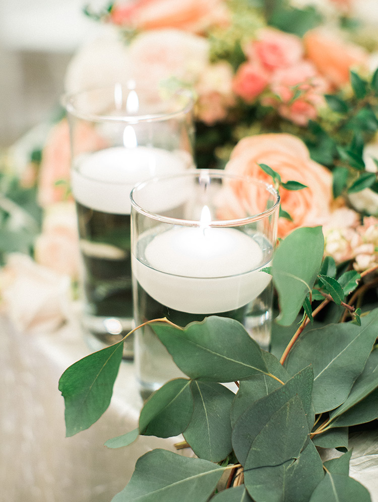 peach & blush flowers with greenery & candles, wedding reception