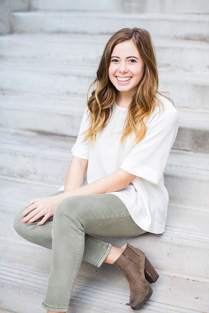 Simple and neutral photo shoot. Girl sitting on steps posing. 