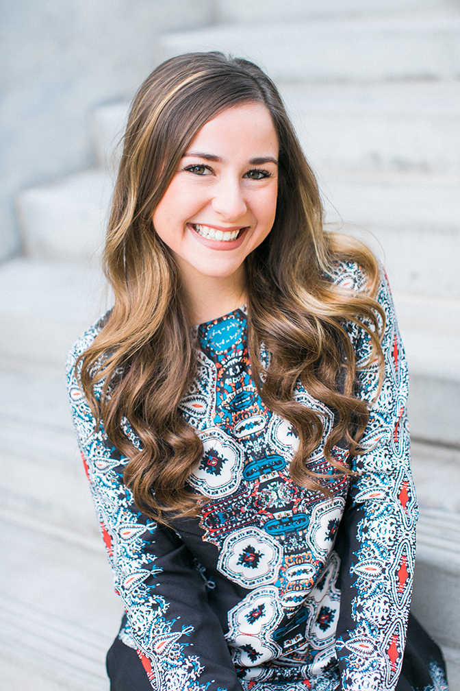 Up close portrait of smiling girl. Unique printed casual dress shoot. 