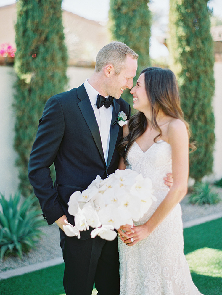 classic black tux and white lace wedding gown