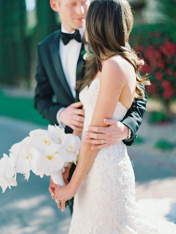 classic black tux and white lace wedding gown